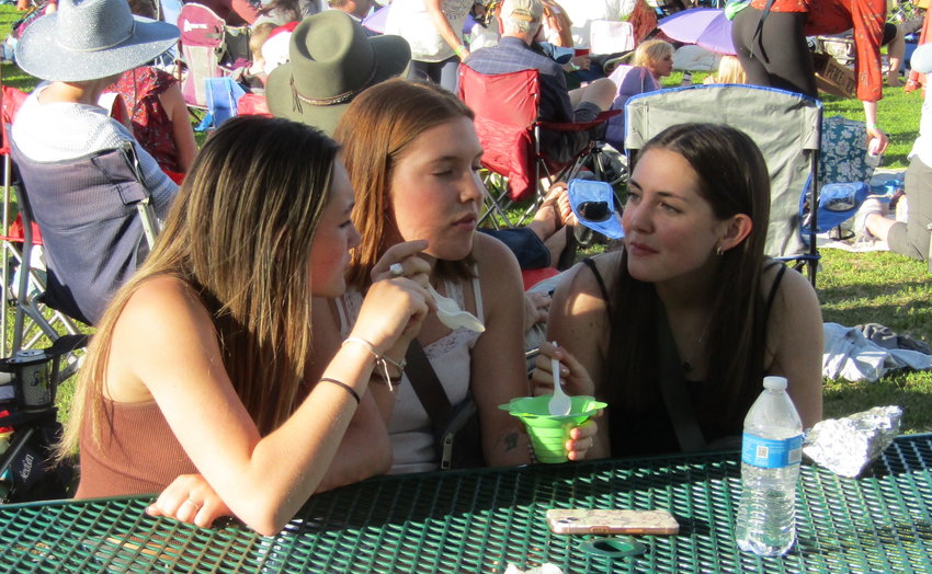 From left, Kaiya Paul, Isabel Cloutier and Katie Legnard, students at Conifer High School, enoy a shave ice from Slife’s Sweet Freeze Shave Ice.